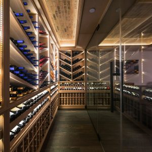 Custom thermostatic home wine cellar with large glass door view 01
